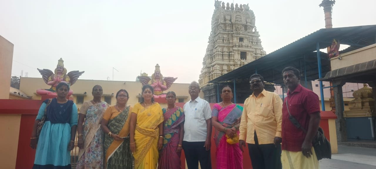 TKM pilgrims at a temple entrance